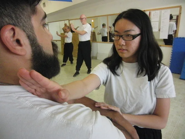 Two students at close range during Chi Sau sticky-hands practice