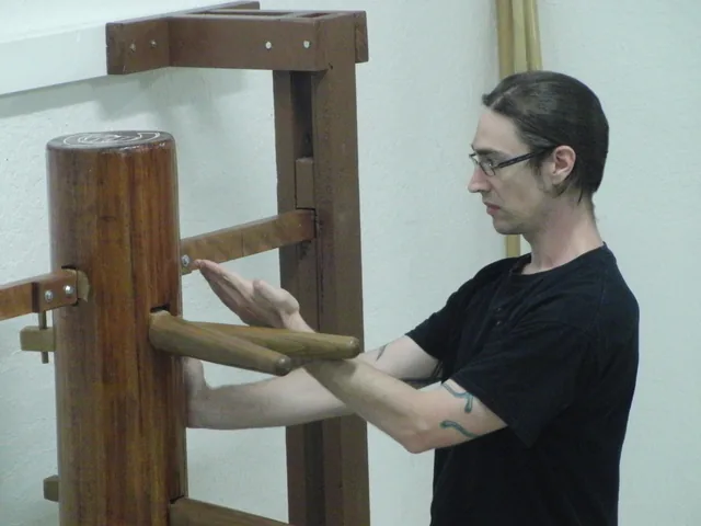 A senior student training on the wooden dummy at Dragon Martial Arts