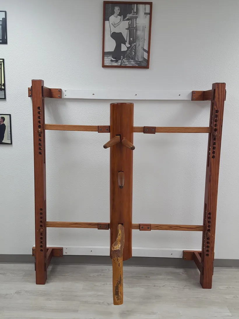 The wooden dummy standing in the Dragon Martial Arts training hall