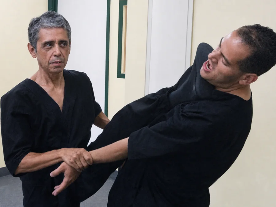 Sifu Gilbert Leal applying a close body kick during Chi Sau